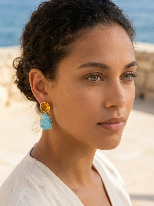 Larimar and amber drop earrings, worn by a model