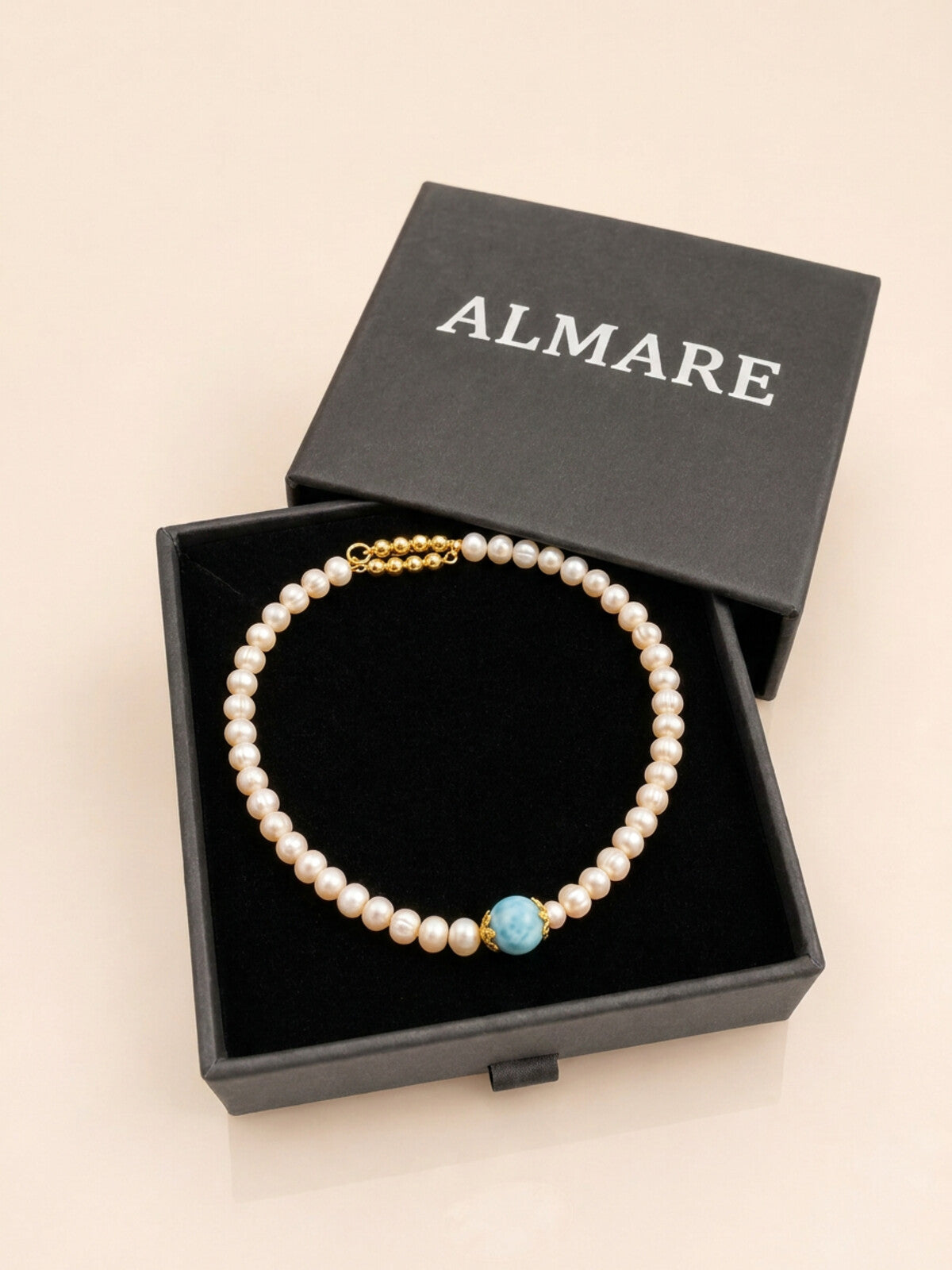Pearl necklace with larimar bead, in the black Almare gift box