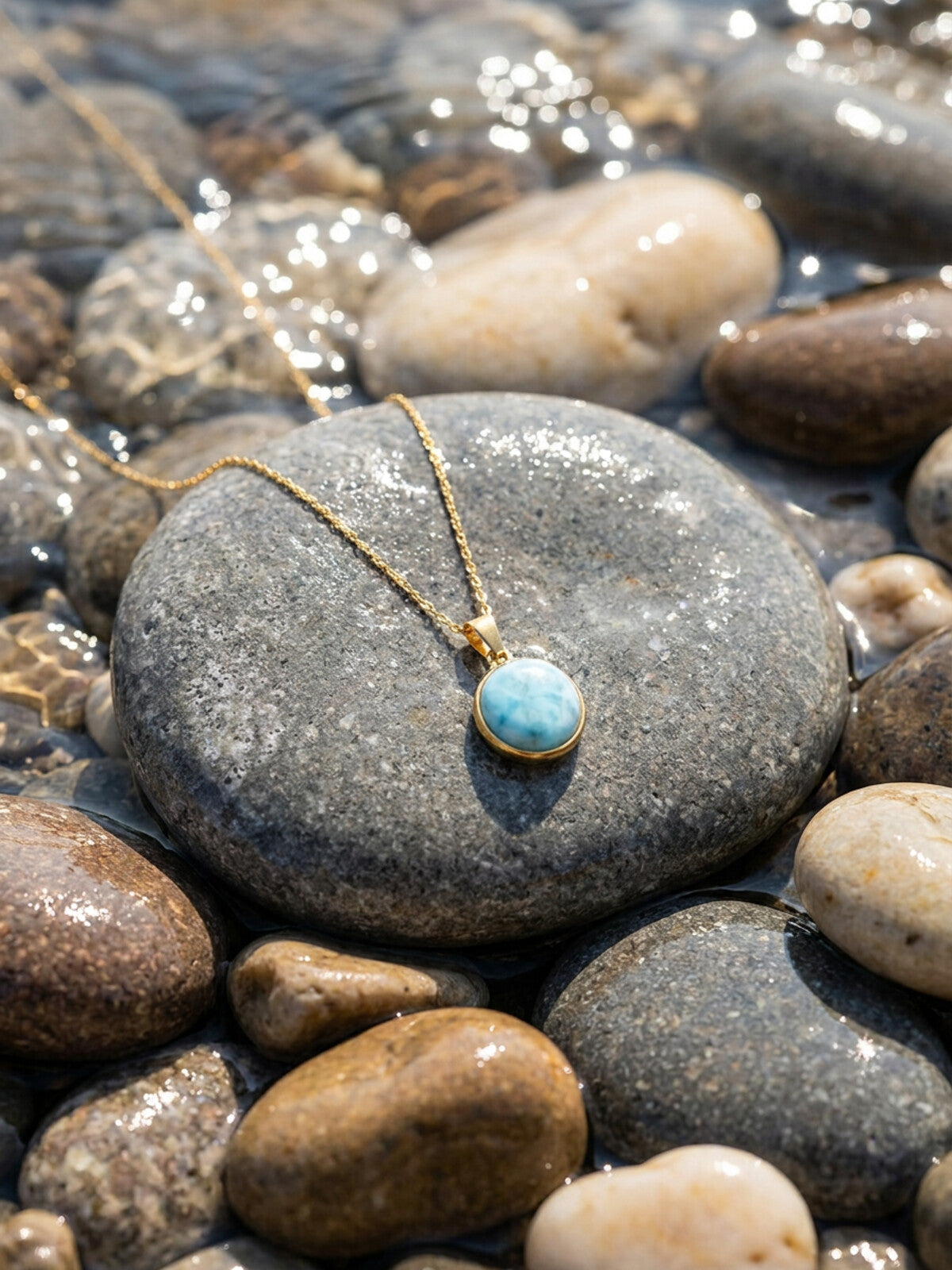 Round larimar necklace, photographed on the beach