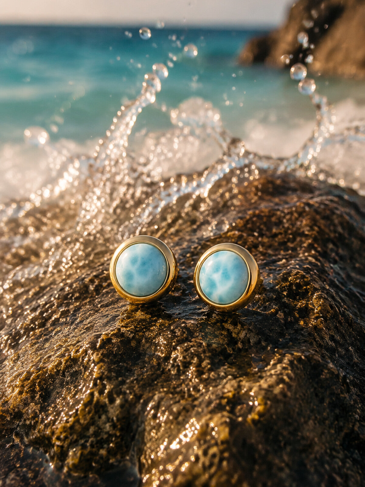 Larimar stud earrings 6mm, photographed on the beach