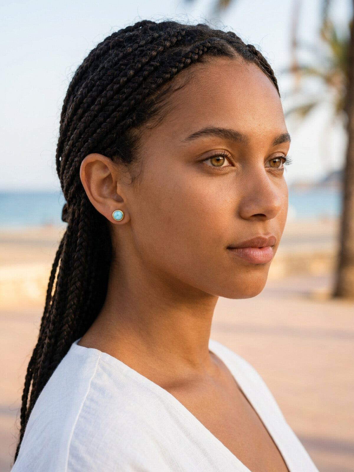 Larimar stud earrings 8mm, worn by a model