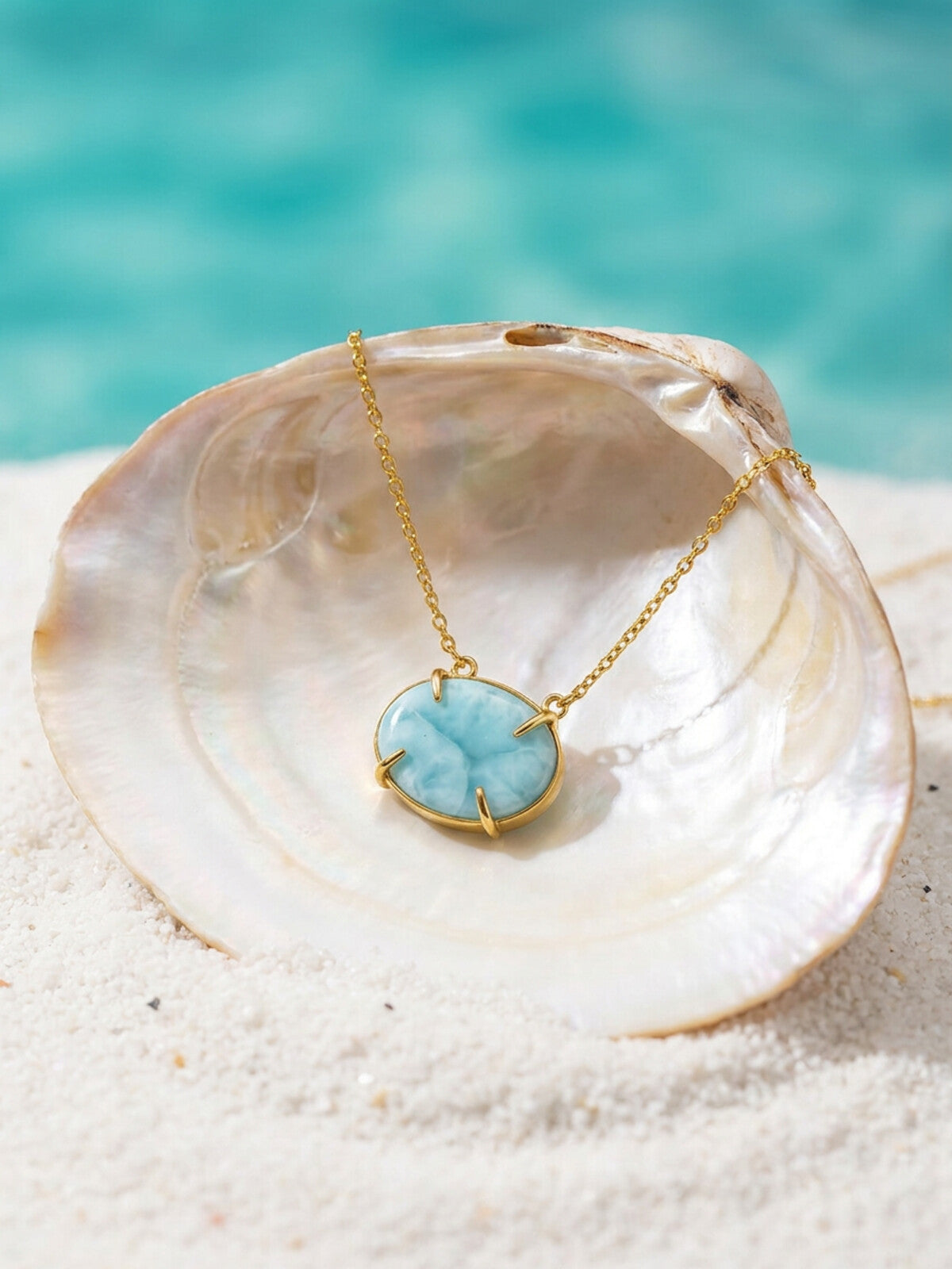 Oval larimar necklace, photographed on the beach